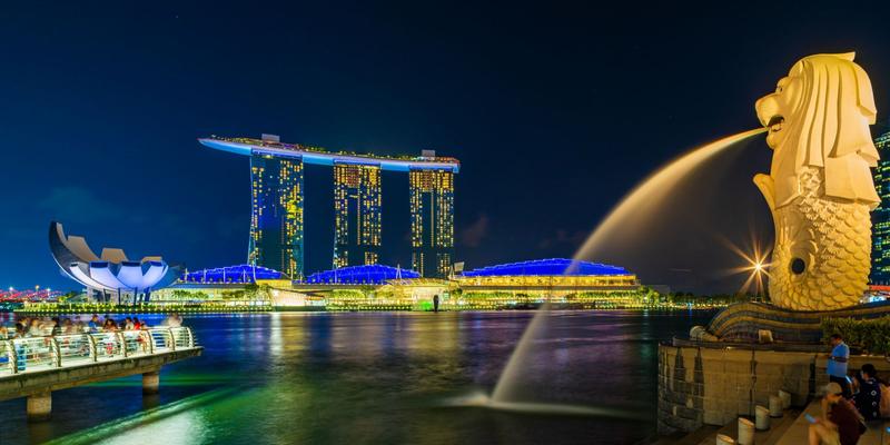 Marina Bay Sands and the waterfront lit at night across Marina Bay in Singapore